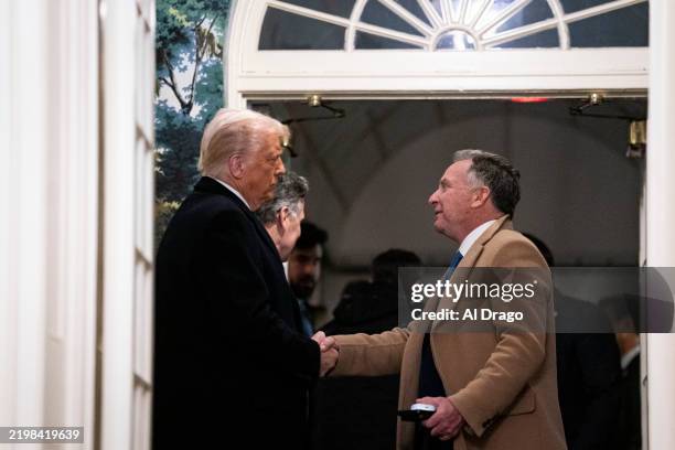 President Donald Trump shakes hands with Steve Witkoff, special envoy to the Middle East, as they as they welcome Marc Fogel back to the United...