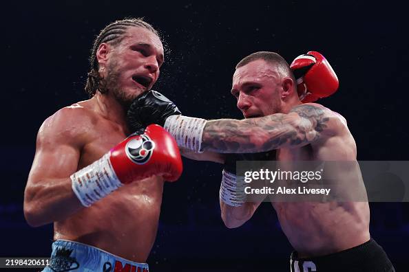 Derek Reece Reece MacMillan punches Jack Rafferty during the British,... News Photo ...