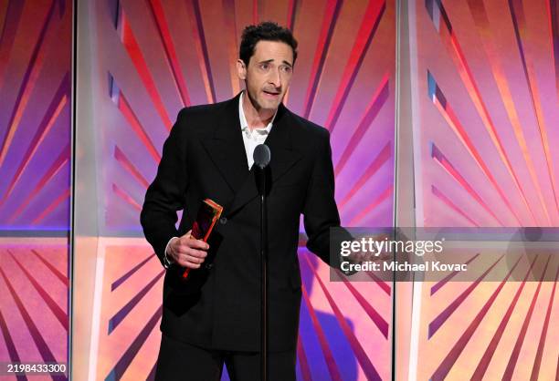 Adrien Brody accepts the Best Actor award for "The Brutalist" onstage during AARP's Annual Movies For Grownups Awards at the Beverly Wilshire, A Four...