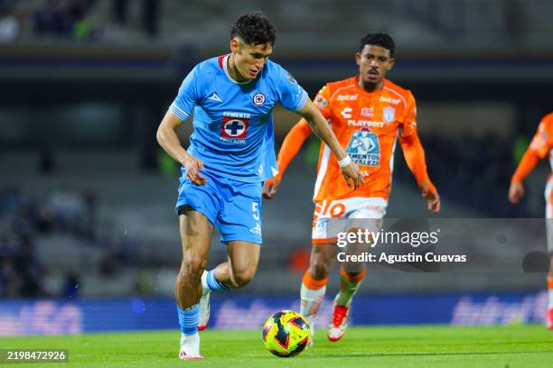 Jesus Orozco of Cruz Azul fights for the ball with John Batista De Souza of Pachuca during the 6th round match between Cruz Azul and Pachuca as part...