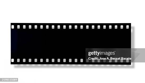 35mm color negative film for photography on a white background. - cinta de película fotografías e imágenes de stock