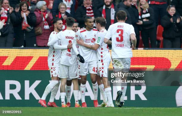 Damion Downs of 1. FC Koeln celebrates with team mates after scoring his teams first goal during the Second Bundesliga match between 1. FC Köln and...