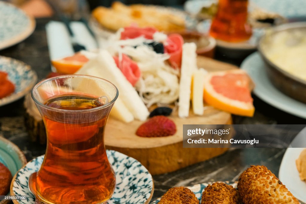 Traditional Turkish breakfast. Table full of plates with snacks. Cheese plate.