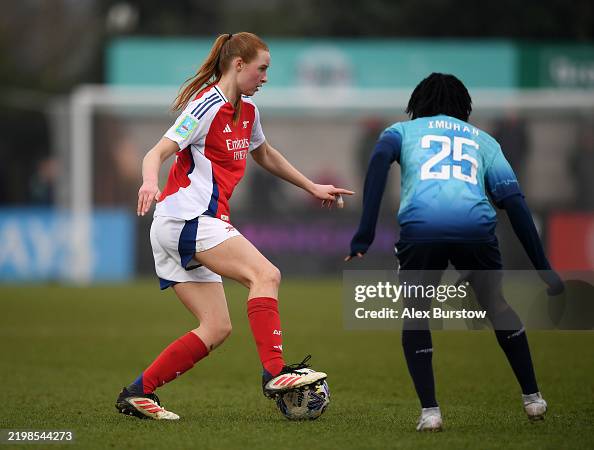 Arsenal Controls Katie Reid of Arsenal controls the ball under pressure from Rofiat ...