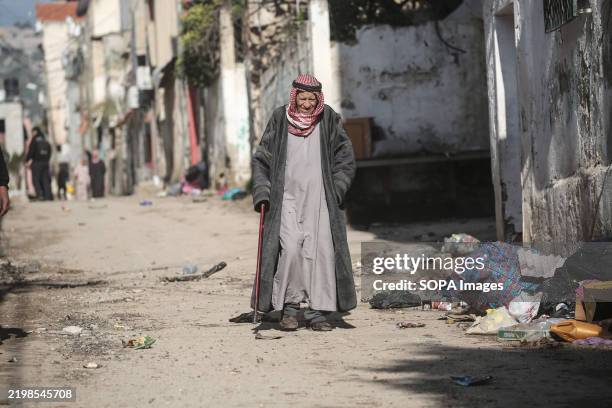 An elderly Palestinian man walks through the destroyed market in the Far'a refugee camp near Tubas in the West Bank. Israeli army forces withdrew...