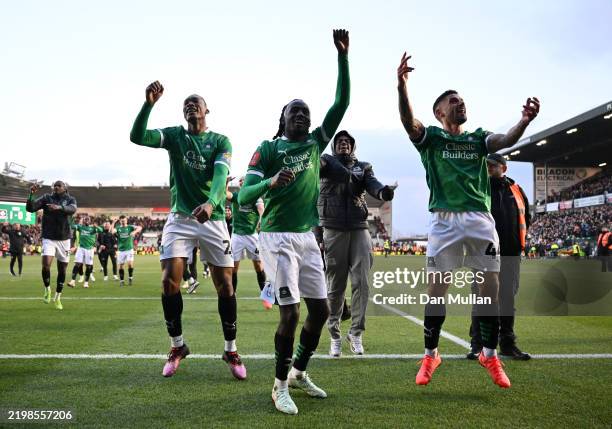 Muhamed Tijani, Malachi Boateng and Victor Palsson of Plymouth Argyle celebrate victory after the Emirates FA Cup Fourth Round match between Plymouth...