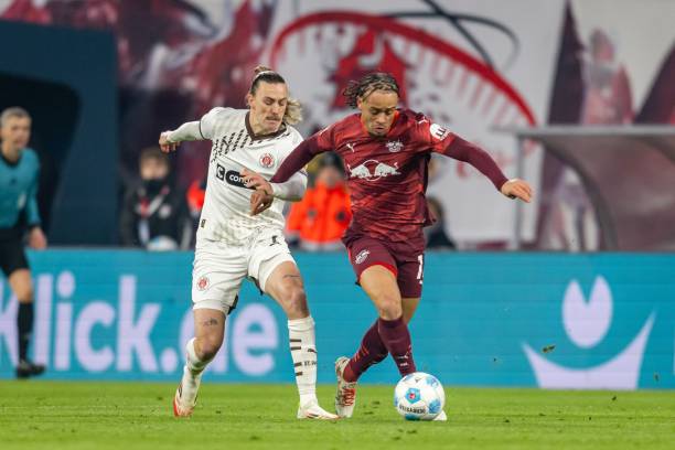 Jackson Irvine of St. Pauli 1910 and Xavi Simons of RB Leipzig in action during the Bundesliga match between RB Leipzig and FC St. Pauli 1910 at Red...