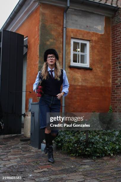 Guest is seen wearing a Navy Knitted Tank Top with a Pair of Denim Shorts at OpéraSport. During the Copenhagen Fashion Week Autumn/Winter 2025 on...