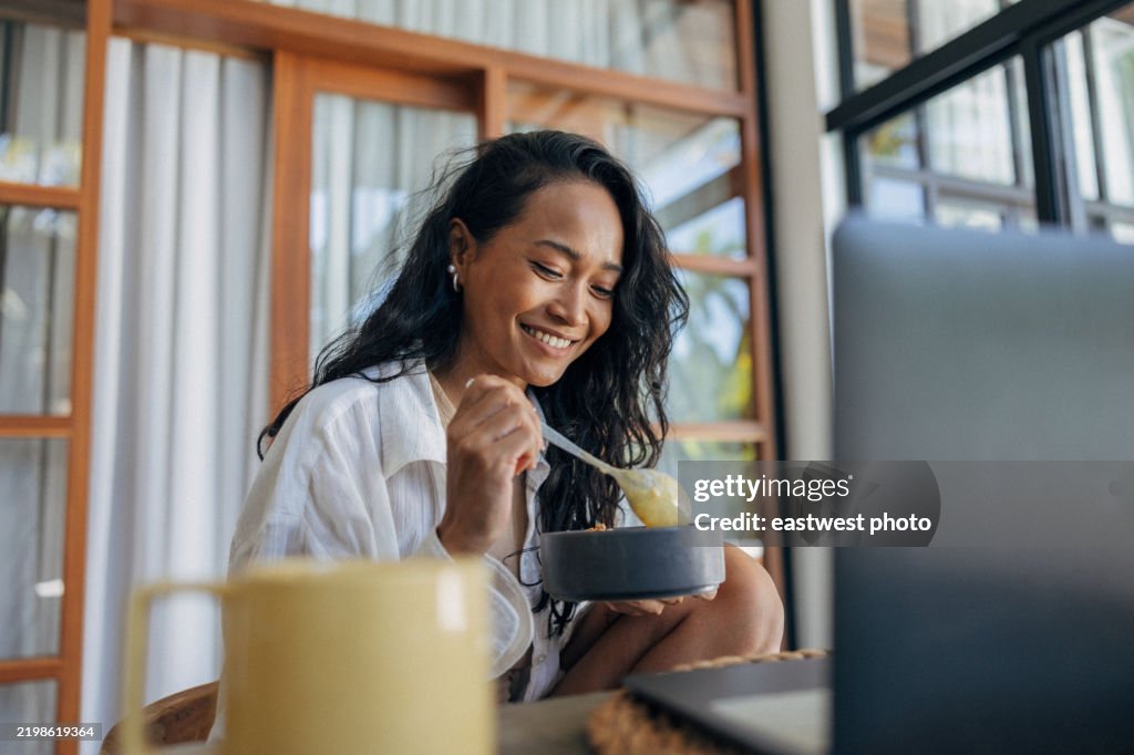 Indonesian woman enjoying her healthy breakfast