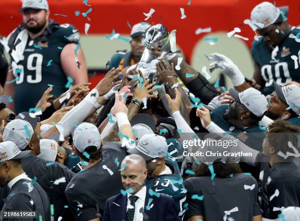 The Philadelphia Eagles celebrate with the Vince Lombardi Trophy after beating the Kansas City Chiefs 40-22 to win Super Bowl LIX at Caesars...