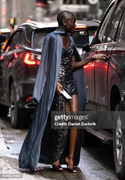 SouKeyna Diouf is seen wearing a blue cape oat and sequin metallic Lapointe dress outside the Lapointe show during NYFW F/W 2025 on February 09, 2025...