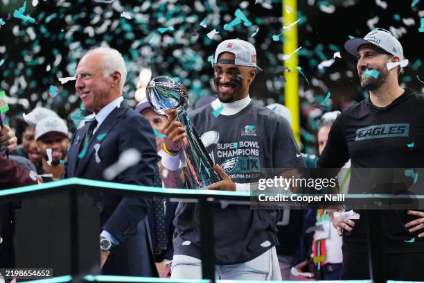 Jalen Hurts of the Philadelphia Eagles holds the Vince Lombardi Trophy after defeating the Kansas City Chiefs during Super Bowl LIX at Caesars...