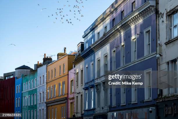 Brightly painted buildings along the A260 Tontine Street on 1st February 2025 in Folkestone, United Kingdom. Tontine street is part of the Creative...