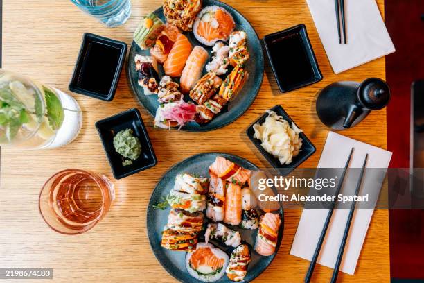 various sushi at a sushi buffet, high angle view - wasabi stock pictures, royalty-free photos & images