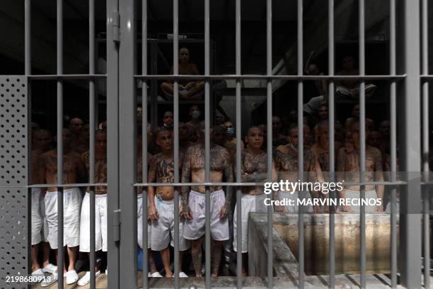 Inmates remain in a cell at the Counter-Terrorism Confinement Centre mega-prison, where hundreds of members of the MS-13 and 18 Street gangs are...