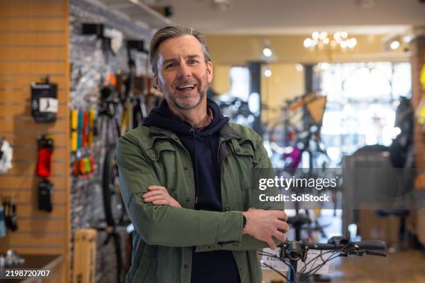 customer portrait in a bike shop - man buying furniture stock pictures, royalty-free photos & images