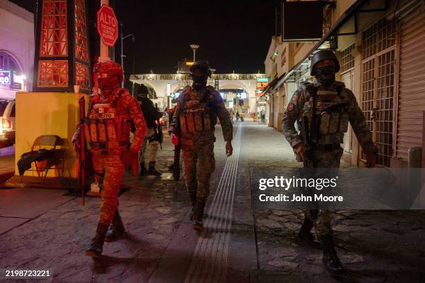 Mexican Army troops patrol near an international bridge between Mexico and the United States early February 10, 2025 in Ciudad Juarez, Mexico....