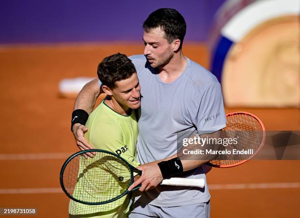 Diego Schwartzman of Argentina greets Pedro Martinez of Spain after loses the match. He played his last match as a professional tennis player during...