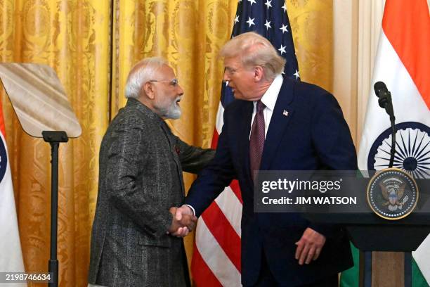 President Donald Trump shakes hands with Indian Prime Minister Narendra Modi during a joint press conference in the East Room of the White House in...