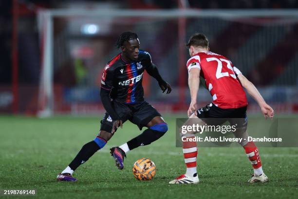 Romain Esse of Crystal Palace controls the ball under pressure from Jack Senior of Doncaster Rovers during the Emirates FA Cup Fourth Round match...