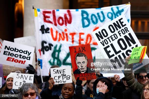 Protesters rally outside the Consumer Financial Protection Bureau on February 10, 2025 in Washington, DC. Lawmakers, federal workers and supporters...