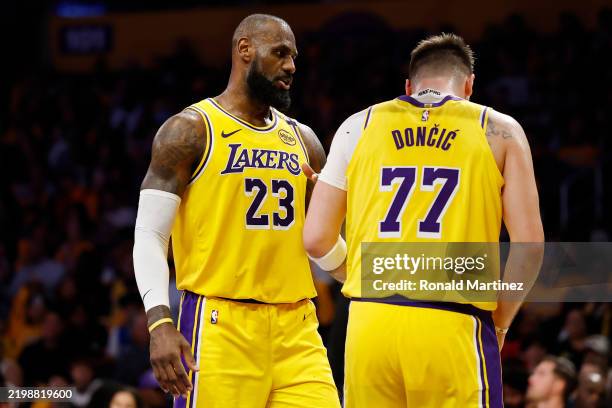LeBron James and Luka Doncic of the Los Angeles Lakers react after Doncic was fouled during the third quarter at Crypto.com Arena on February 10,...