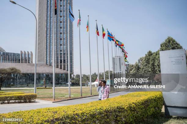 People walk around at the AU Headquarters ahead of the 38th African Union Summit, where leaders will elect a new head of the AU Commission, in Addis...
