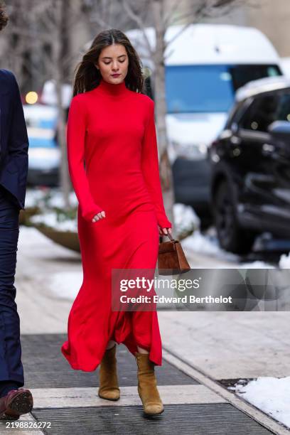 Guest wears bright cherry red high neck long sleeve form fitting Carolina Herrera maxi dress, dark brown leather mini bag, light brown pointed toe...