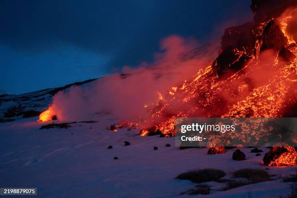 Lava flows from a fracture on the Mount Etna during an eruption of the volcano on February 14, 2025.