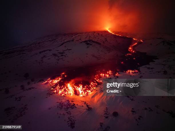 Lava flows from a fracture on the Mount Etna during an eruption of the volcano on February 14, 2025.