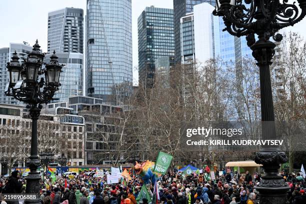 Participants march during a 'Fridays for Future' demonstration as part of a nationwide protest for climate action at the banking district in...