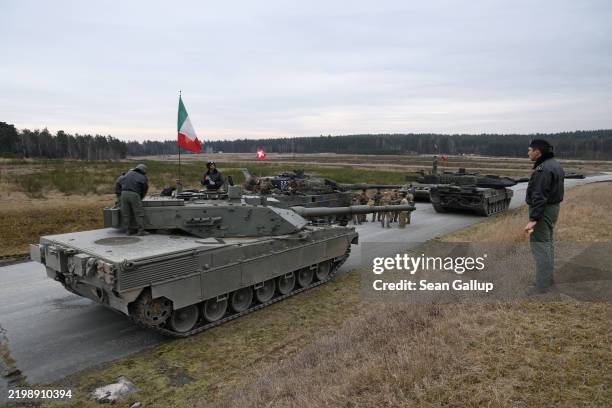 Tank crews from different countries, including an Italian crew on their Italian Army C1 Ariete, prepare their main battle tanks during the U.S. Army...