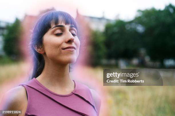 woman with glowing outline, eyes closed - expressionism stock pictures, royalty-free photos & images