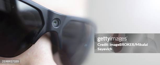 close-up of black-framed sunglasses with a subtle reflection, simple and minimalistic - sunglasses reflection stock illustrations