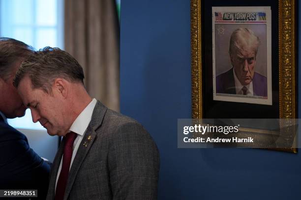 Copy of U.S. President Donald Trump's mugshot on the front of the New York Post is framed in an office just outside the Oval Office as U.S. National...
