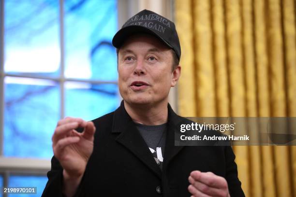 Tesla and SpaceX CEO Elon Musk delivers remarks as he joins U.S. President Donald Trump during an executive order signing in the Oval Office at the...