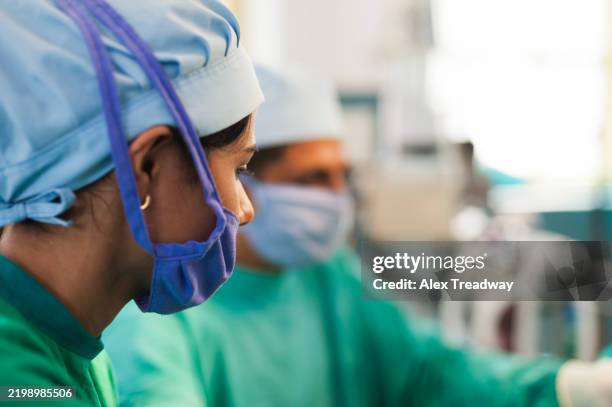 nurse in nepal - operating gown stock pictures, royalty-free photos & images