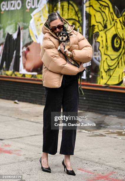 Jenna Lyons is seen wearing a tan puff jacket, black pants, black heels and black sunglasses outside the Kallmeyer show during NYFW F/W 2025 on...