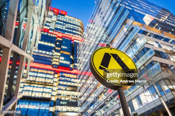 pedestrian crossing sign in cityscape at night - pedestrian stock pictures, royalty-free photos & images