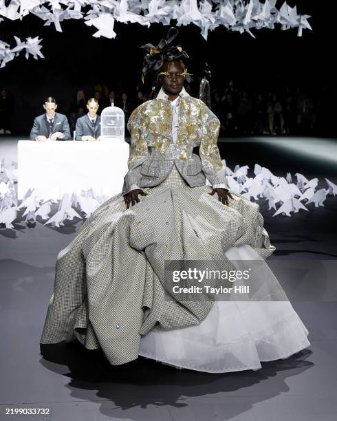 Alek Wek walks the runway during the F/W 2025 Thom Browne fashion show during New York Fashion Week at The Shed on February 11, 2025 in New York City.