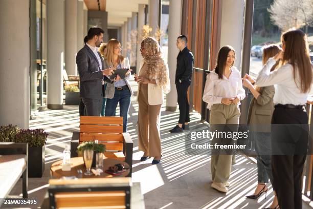 diverse businesspeople having great time before conference - conference centre europe outside stock pictures, royalty-free photos & images