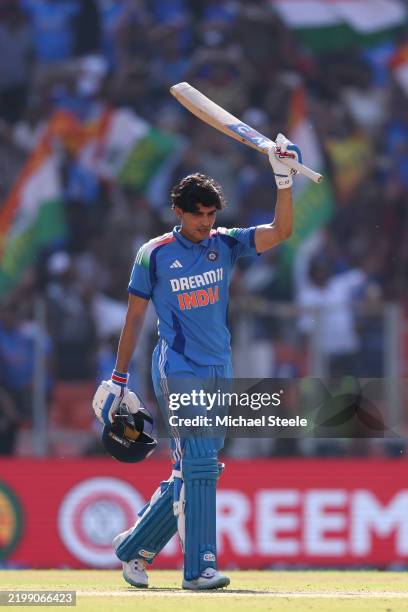 Shubham Gill of India acknowledges the home crowd as he reaches his century during the 3rd ODI match between India and England at Narendra Modi...