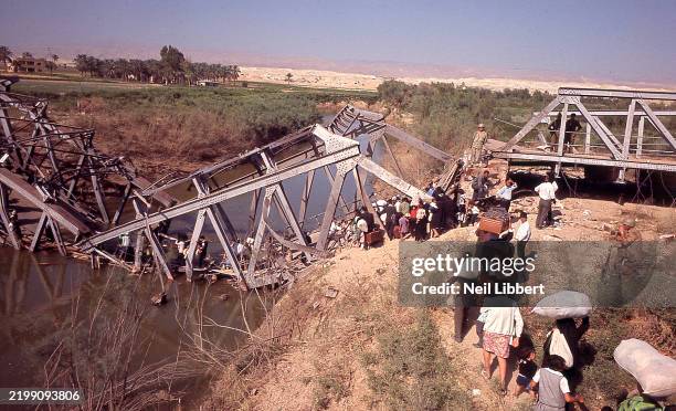 Displaced Palestinians from Ramallah, West Bank, being sent one by one to Jordan over the remains of the destroyed Allenby Bridge during the Six Day...