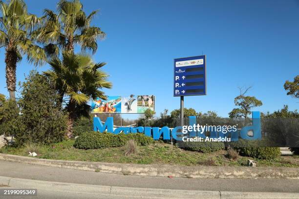 View of the entrance to the now-closed Hotel Marineland, with its sign and palm trees in Antibes, France on February 15, 2025. The park, which closed...