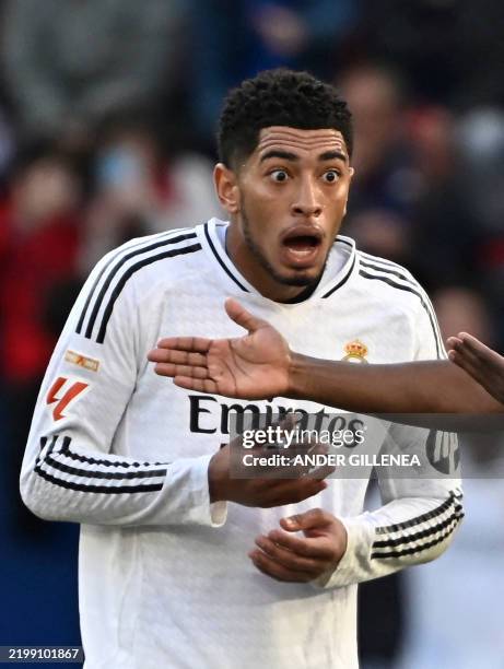 Real Madrid's English midfielder Jude Bellingham reacts to his red card during the Spanish league football match between CA Osasuna and Real Madrid...