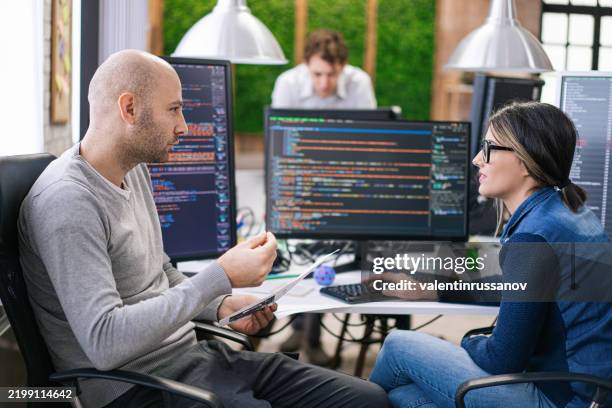 software programmers analyzing html code and database, brainstorming script ideas to develop new security system. engineers working with coding language collaborating on group project - data scientist stock pictures, royalty-free photos & images
