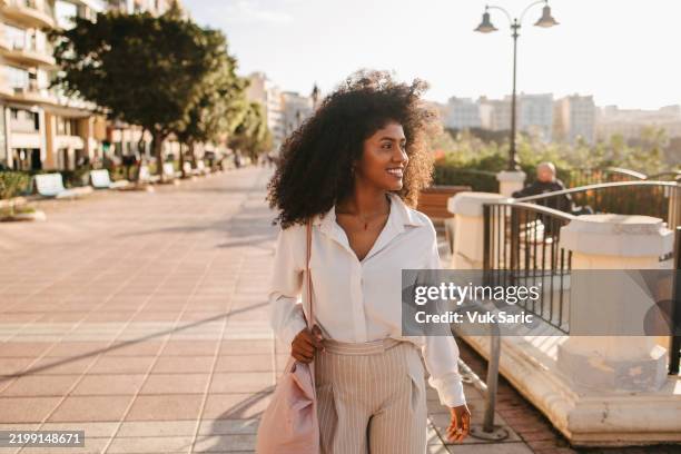 portrait of a young african woman in malta - sustainable fashion stock pictures, royalty-free photos & images