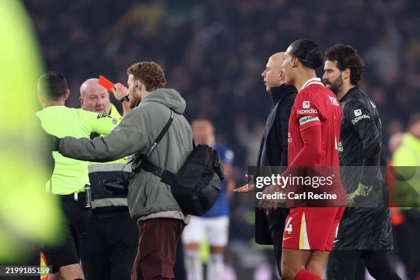 Arne Slot, Manger of Liverpool, is shown a red card by referee Michael Oliver at the end of the Premier League match between Everton FC and Liverpool...