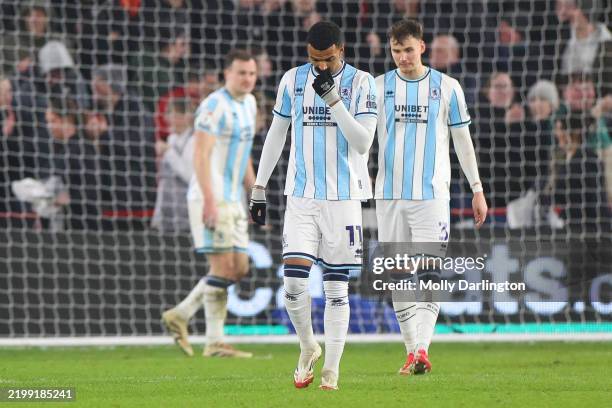 Isaiah Jones and Rav van den Berg of FC Middlesbrough react after Anel Ahmedhodzic of Sheffield United FC scored third goal during the Sky Bet...