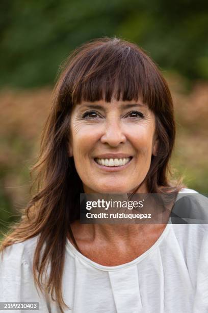 portrait of a beautiful and happy 52 year old woman - long hair stock pictures, royalty-free photos & images